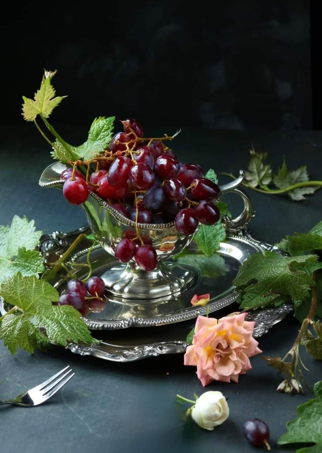 Red grapes placed on silver dishes